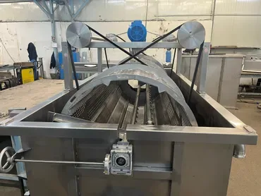 Stainless steel machine with a rotating drum during construction