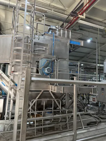 Stainless steel equipment with access ladder and platform during assembly