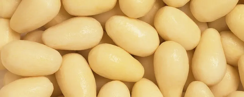Steam peeled potatoes after the brush finisher